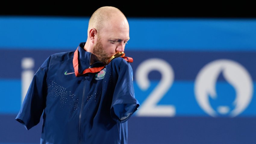Gold medalist Matt Stutzman of the United States kisses the medal during the awarding ceremony of the para archery men's individual compound open event at the Paris 2024 Paralympic Games in Paris, France, Sept. 1, 2024. (Photo by Hou Jun/Xinhua via Getty Images)