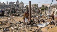GAZA CITY, GAZA - AUGUST 1: Residents inspect the damage caused by Israeli airstrikes last night on residential buildings in the Safatawi area on August 1, 2026 in Gaza City, Gaza. Israel continues military actions in Gaza during the fragile easefire agreement which is frequently contested, and marred by mutual accusations of violations. (Photo by Ahmad Hasaballah/Getty Images)