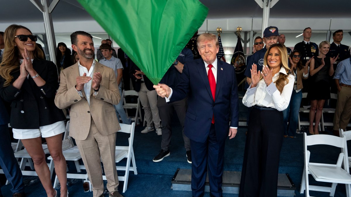 Trump waves the green flag to start the IndyCar race as drivers zoom through Washington’s streets