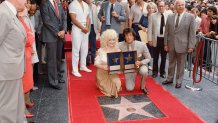 American country music singer and songwriter Dolly Parton and actor, director, screenwriter and producer Sylvester Stallone receive stars on the Hollywood Walk of Fame.
