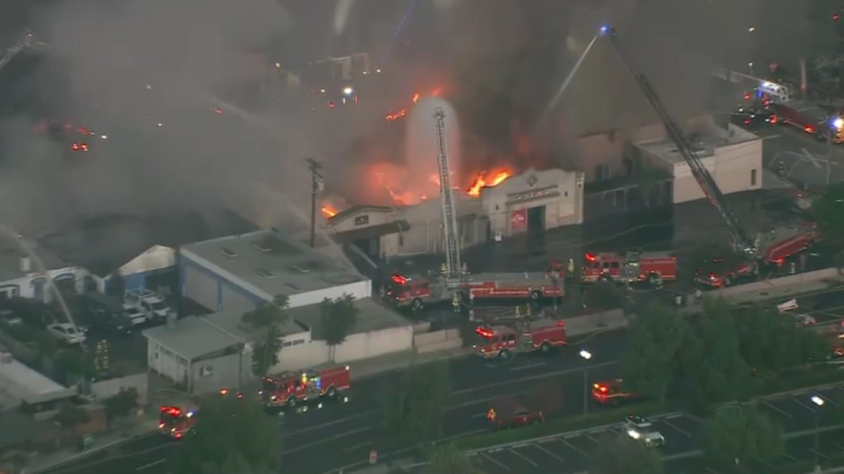 Newhall auto body shop fire spreads to restaurant, theater and other businesses