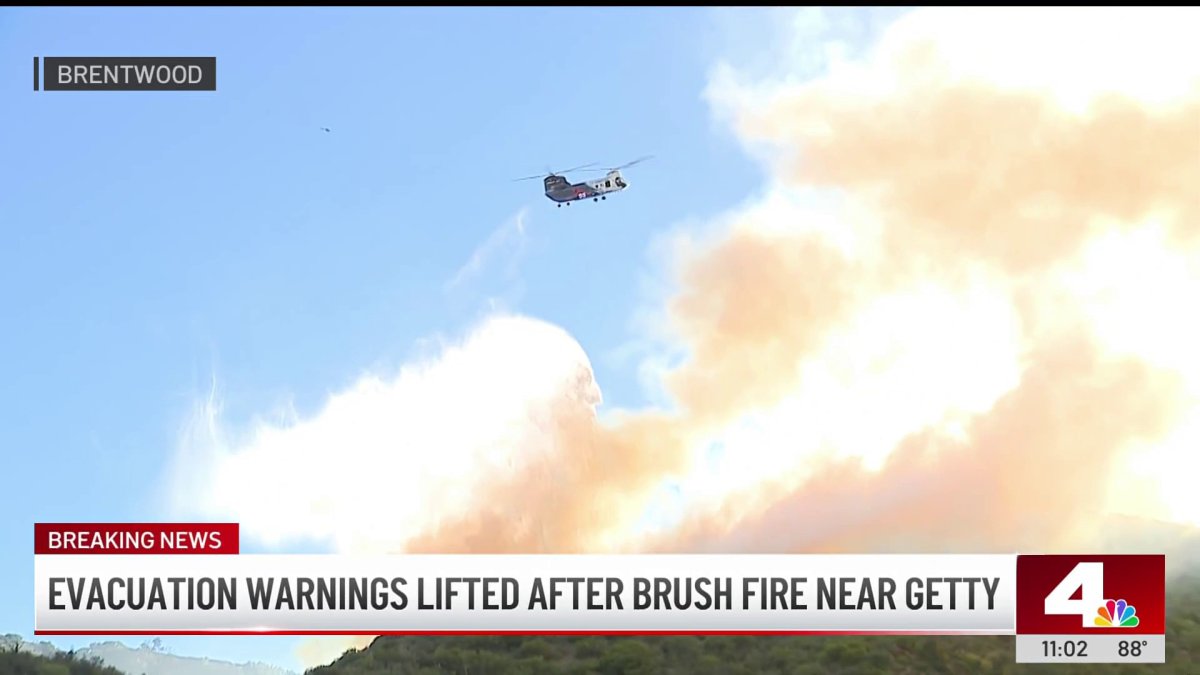 Evacuation warnings lifted, Getty Center still closed as crews battle brush fire