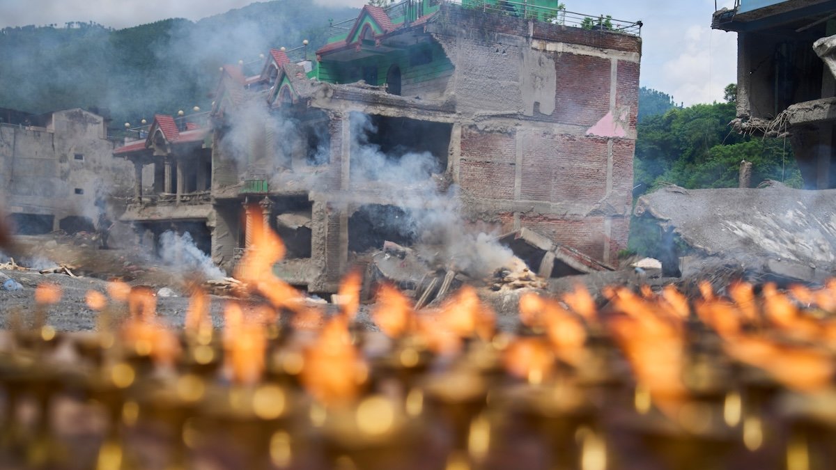 Nepal holds a day of mourning after floods kill at least 1,300 people