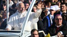 Pope Leo XIV waves to worshippers as he arrives on board of the Papamobile to celebrate a holy mass at the Prairie of the Shrine of Our Lady of Lourdes, southwestern France, on September 27, 2026.