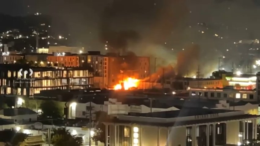 A structure fire burns in Chinatown on Thursday, Oct. 8, 2026.