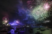 Fireworks explode over Sydney Harbour during New Year