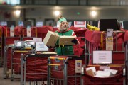 A mail worker dressed as an elf processes mail at the Royal Mail Christmas sorting office on December 16, 2016 in Llantrisant, Wales. Hundreds of temporary workers are employed over the Christmas period to process the increased volume of mail.