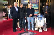 Actors Harrison Ford and Mark Hamill appear with director George Lucas for Hamill