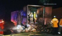 Firefighters extinguish a burning trailer carrying 15,000 pounds of apple pies Thursday July 12, 2018 in Rancho Cucamonga.