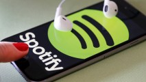 In this photo illustration, the logo of the Swedish music streaming service Spotify is displayed on the screen of an iPhone on Jan. 6, 2017 in Paris. On Wednesday Spotify announced the company will go public.