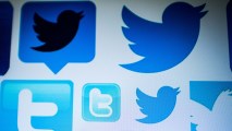 This photo illustration taken on March 23, 2018, shows Twitter logos on a computer screen in Beijing.