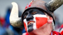 A fan of Norway celebrates after the men
