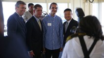 This May 31, 2016, file photo shows Joel Oritz, center, poses with Boston Public Schools school committee official Michael D. O