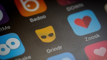The "Grindr" app logo is seen amongst other dating apps on a mobile phone screen on Nov. 24, 2016, in London, England.