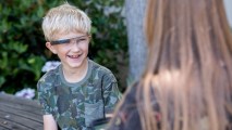 Alex, 9, wears Google Glass while talking with his mother Donji Cullenbine in this undated handout photo. He was part of a study that used the devices to help kids with autism recognize facial expressions.