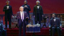 This undated video screen shot provided by Walt Disney World shows an animatronic figure of Donald Trump, center front, at the Hall of Presidents attraction at Walt Disney World in Orlando, Fla. The Trump figure moves his head during the traditional roll call of leaders, motions with his arms and gives a brief speech.