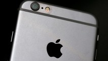 FILE - The Apple logo is displayed on an iPhone 6 on July 21, 2015 in San Francisco, Calif.