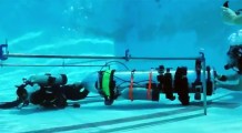 SpaceX test a tiny submarine designed to help rescue 12 soccer team members and a coach trapped in a Thailand cave.