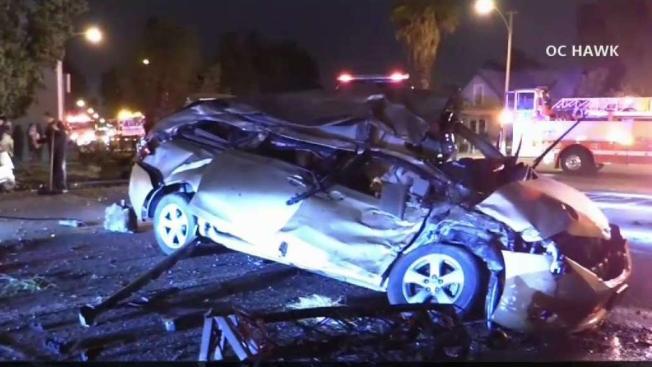 Driver Crashes Into Two Parked Cars Before Ending Up On Top Of Truck